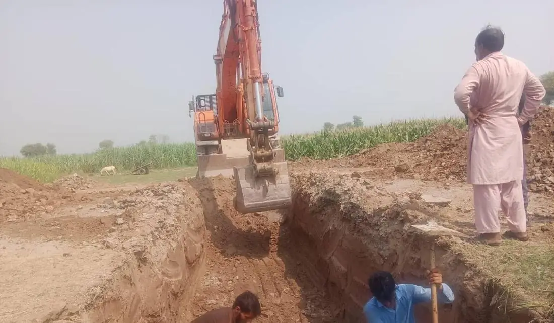 Excavator trenching